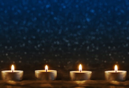 Many Candles In A Row On Blue Background